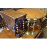 A waxed pine coffee table, the moulded circular top raised on a turned column and quad supports to/w