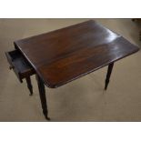 A Victorian mahogany pembroke table with end drawer, turned supports and brass castors