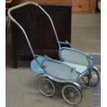 A 1940s Leeway, made in England, child's pushchair with poodle-printed sun canopy