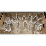 A box of drinking glasses including a set of ten wine glasses with engraved bowls