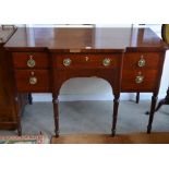 A 19th century mahogany sideboard with four drawers, raised on turned supports