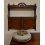 A mahogany wall hanging shelf with panelled cupboards to/w a mahogany and floral tapestry stool (2)