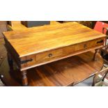 A hardwood coffee table with drawers, on turned legs