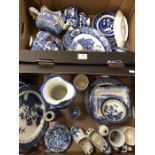 A box of blue and white transfer printed tea wares, mainly willow pattern and a Royal Doulton