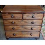 A 19th century mahogany chest of two short over three long graduating drawers with turned handles,