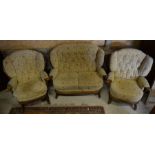 A three piece Ercol cottage suite comprising a two seat sofa, an armchair and a rocking chair (3)
