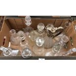 A box of assorted decanters