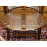 A brass bound mahogany Campaign style folding tray top coffee table (tray and stand)