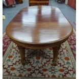 A Victorian mahogany wind-out dining table