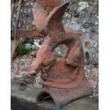 A large cast terracotta dragon ridge tile