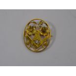 An antique 18ct yellow gold diamond-set oval brooch