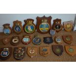 A collection of Naval ship's badges and related items