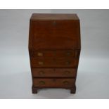 A George III cross-banded mahogany bureau of compact size