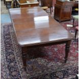 A large Victorian mahogany wind action dining table