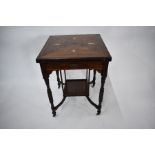 An antique inlaid rosewood envelope card table