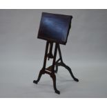 An antique mahogany adjustable easel music stand