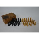 A set of turned wood chessmen
