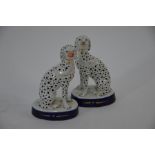 A pair of Victorian Staffordshire models of seated dalmatian dogs