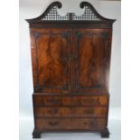 A late 19th / 20th century Chippendale style linen press