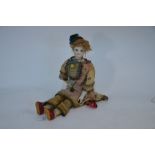 An unusual 19th century doll having a French Jumeau porcelain head