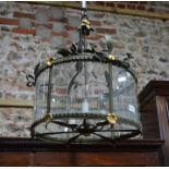 A circular gilt-metal and glass panelled hanging lantern