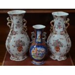 A pair of 18th century Chinese famille rose vases to/w a smaller famille rose vase