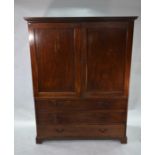 An Edwardian mahogany leather top writing table