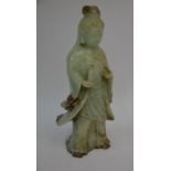 A Chinese carved green hardstone figure of Guanyin, 25 cm high