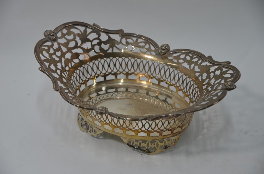 An Edwardian Sheraton revival pierced silver bonbon basket
