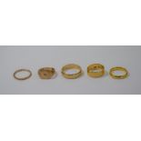 A collection of five various gold rings
