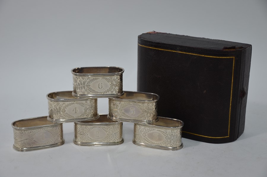 A Victorian cased set of six foliate-engraved silver napkin rings - Image 2 of 3