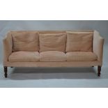 A late 19th/20th century three seat wing-back sofa