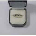 A sapphire and diamond half eternity ring
