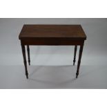 A George IV mahogany fold-over tea table