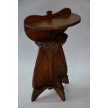 An Art Nouveau oak demi-lune console table