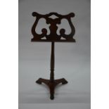 A Victorian mahogany and brass fitted rise and fall music stand