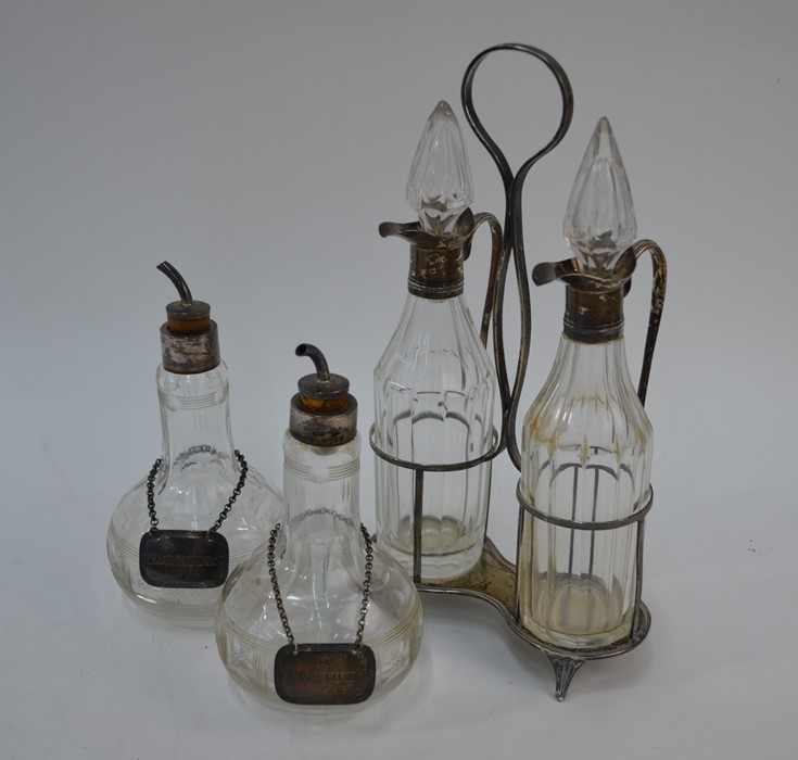 A pair of George III cut glass oil and vinegar bottles, pair of bitters bottles and labels