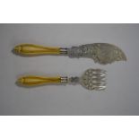 A Victorian pair of engraved and pierced silver fish servers