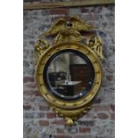 A 19th century giltwood framed circular mirror