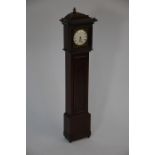 An early 19th century mahogany miniature longcase clock watchstand