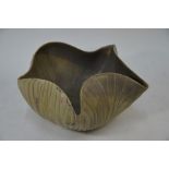 A studio pottery bowl with shaped top and organic form