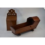 A 19th century fruitwood doll's cradle