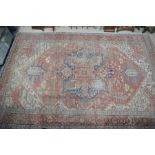 A large antique Persian Serapi carpet