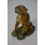 A 19th century Chinese stoneware figure of a seated tiger, sancai glaze, Qing dynasty