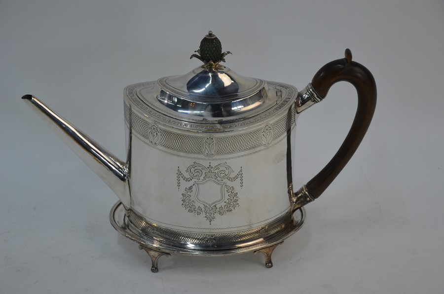 A George III silver teapot on stand