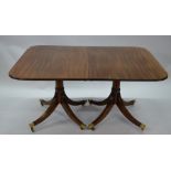 A Victorian mahogany twin pedestal dining table