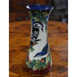 A contemporary Moorcroft tall vase decorated with the 'Ingleswood' pattern