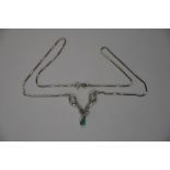 A diamond and emerald pendant necklace