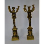 A pair of Empire style ormolu candelabra