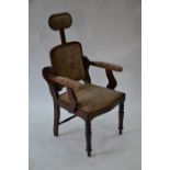 A vintage patent hardwood dentist/barbers chair circa 1920's